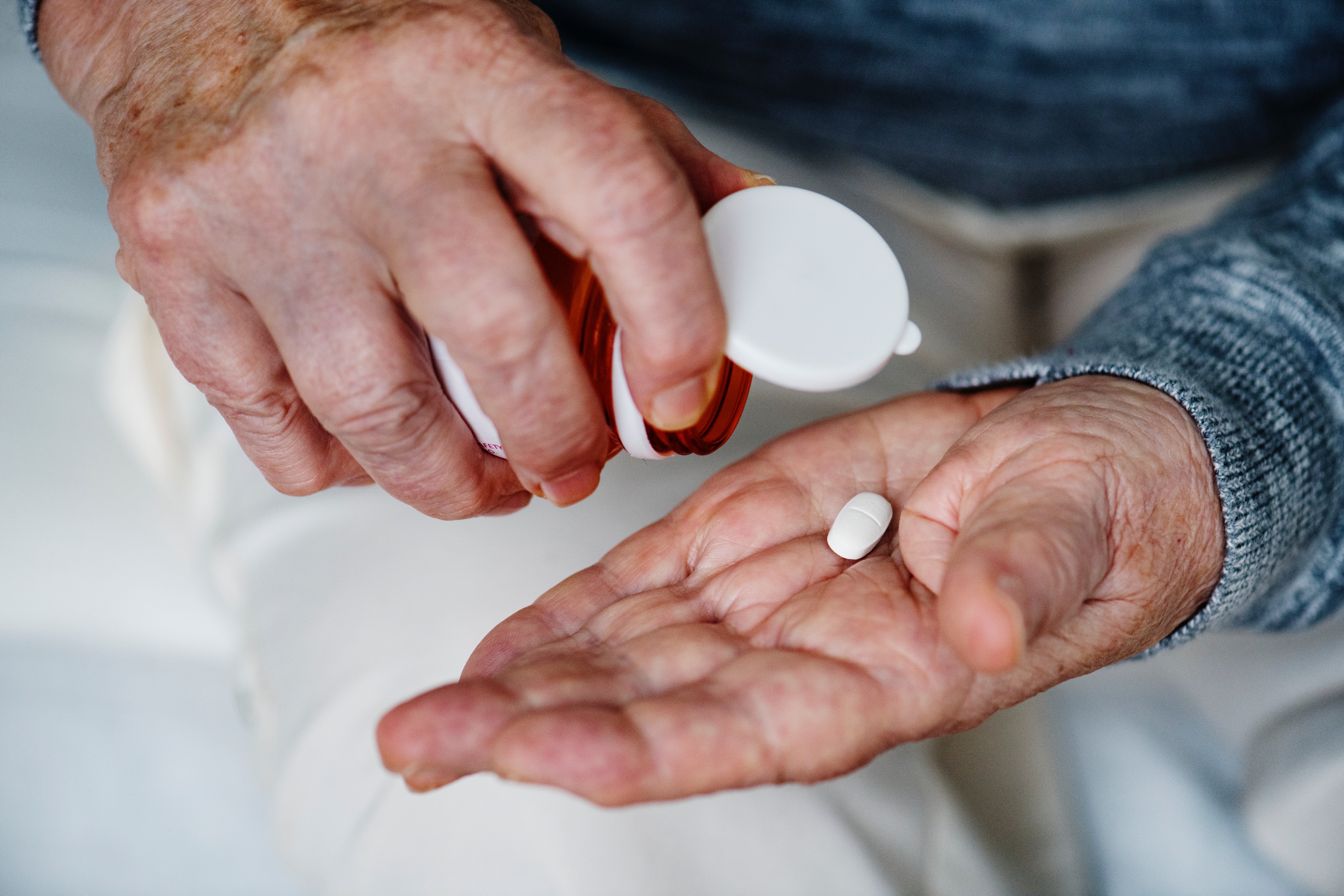 elderly taking medicine
